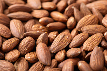 Close-up shot of almond nuts. Macro shot of tasty dried almonds