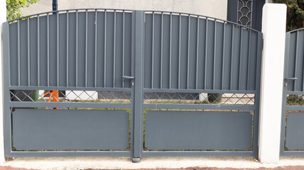 door grey iron gate home aluminum portal of suburb house in street view