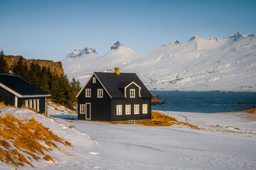 Teigarhorn Natural Monument and Nature Preserve farm with sea and snow mountain at Djúpivogur , Peninsula near Austurland East of Iceland : 19 March 2020