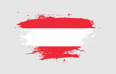 Grunge brush stroke with the national flag of Austria on a white isolated background