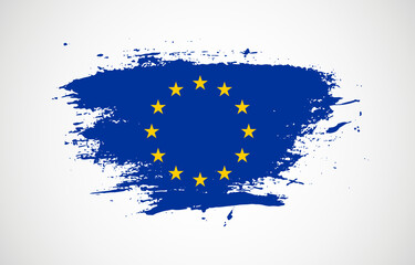 Grunge brush stroke with the national flag of European Union on a white isolated background