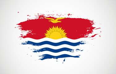 Grunge brush stroke with the national flag of Kiribati on a white isolated background
