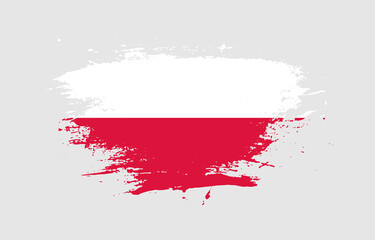 Grunge brush stroke with the national flag of Poland on a white isolated background
