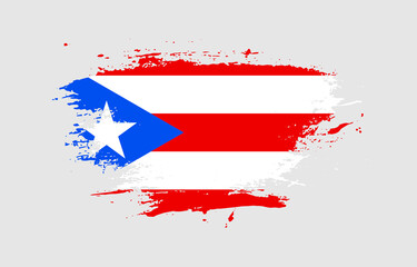 Grunge brush stroke with the national flag of Puerto Rico on a white isolated background