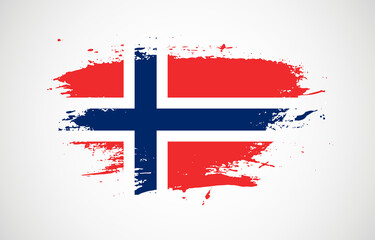 Grunge brush stroke with the national flag of Norway on a white isolated background