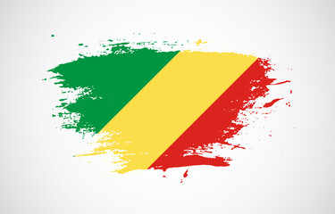 Grunge brush stroke with the national flag of Republic of the Congo on a white isolated background
