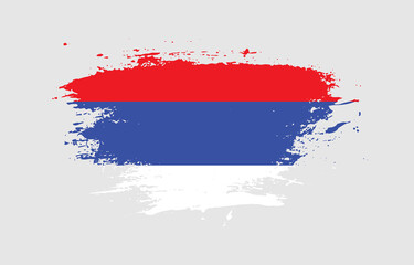 Grunge brush stroke with the national flag of Republika Srpska on a white isolated background