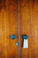 Traditional wooden door with two steele handles