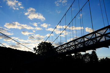 View of a bridge in Hann. Münden. Dark silhouette of the construction in the evening sky.