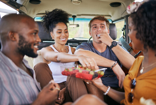 Diversity, food and friends on road trip with fruit while on holiday vacation eating watermelon, grapes and strawberry. Happy and hungry young men and women enjoying healthy fresh organic produce