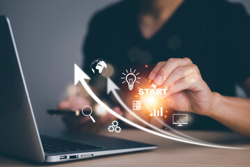 Startup concept Laptop with icon business and network connection on modern virtual interface from digital tablet.Businessman Touching tablet and graph Screen Icon of media screen, Technology Process