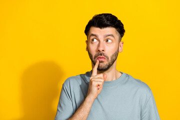 Photo of minded man dressed stylish clothes interested look empty space failure mistake isolated on yellow color background