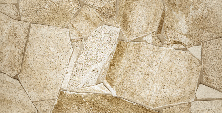 Bruchstein Mauer aus hellen Steinen als Textur oder Hintergrund 