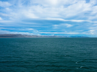 Spectacular panorama view of Wilhelmoya island with mountain range and blue sky. Torellneset, Nordaustlandet Spitsbergen, Norway. Tourism and vacations concept.