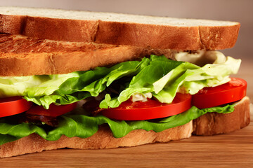 blt sandwich; a tasty breakfast, lunch, or snack; with meat and vegetables