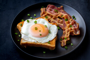 Fried eggs with bacon. Bacon and egg as English breakfast.
