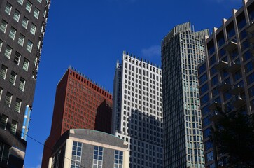 Obraz premium Exterior of beautiful buildings against blue sky, low angle view