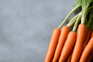 bunch of fresh carrots, a healthy natural vegetable, green produce