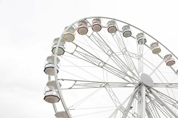 Large white observation wheel against sky, low angle view