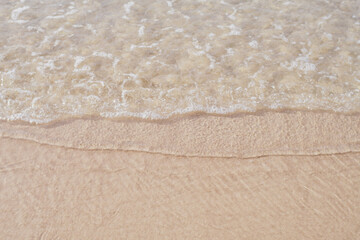water waves bubbles on the beach