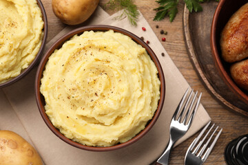Flat lay composition with tasty mashed potatoes on wooden table