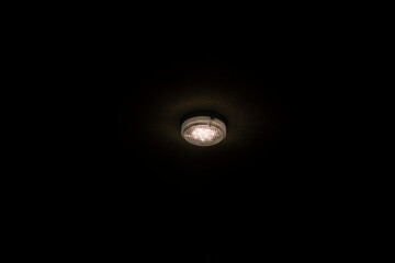 Lamp in dark. Light source. Electric glow.