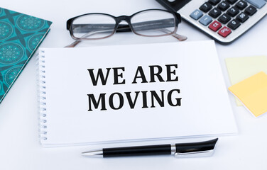 we're moved text on notepad on office desk