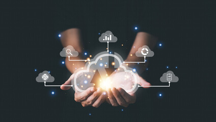 Cloud computing technology concept with businessman. Big data analytics and business intelligence concept with chart and graph icons on a digital screen interface.