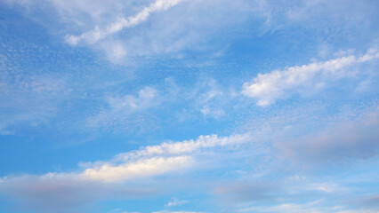 Whispy beautiful clouds at bright sunny day. Atmosphere background