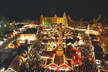 Traditional Christmas market in Erfurt, Thuringia in Germany. With xmas tree, pyramide and sales...