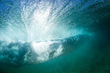 underwater scene with a huge crashing wave