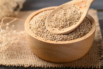 Brown quinoa seed in wooden bowl with spoon, Super food