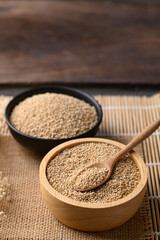 Brown quinoa seed in wooden bowl with spoon, Super food