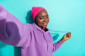 Self portrait of attractive cheerful girl posing rest good mood blog isolated over vivid teal...