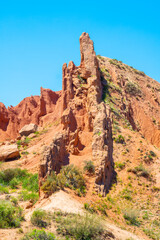 Fototapeta premium Ancient rocks made of red clay against the blue sky