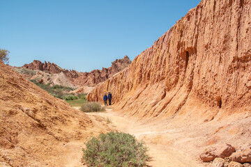 Ancient rocks made of red clay against the blue sky