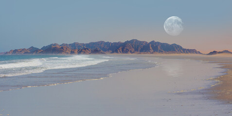 Namib desert with Atlantic ocean meets near Skeleton coast with full moon - 
Namibia, South Africa...