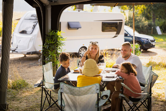 Family sitting at picnic table