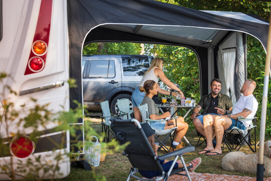 Family Relaxing At Camping Site