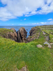 Fototapeta na wymiar The cliffs close to the Lighthouse on Tory Island, County Donegal, Republic of Ireland