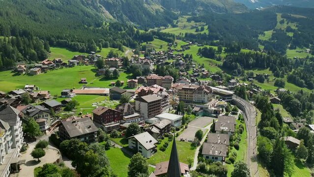 Aerial reveal and approach over Wengen, Switzerland