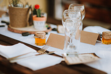 wedding decoration table with glasses in brown and white colors