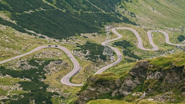 Footage of Transfagarasan road in Romanian Carpathian mountains from above during summer time.