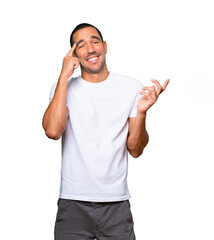 Fototapeta premium Surprised young man doing a gesture of concentration