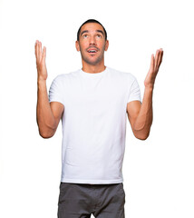 Astonished young man looking up