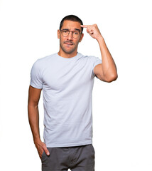 Concerned young man doing a gesture of confusion