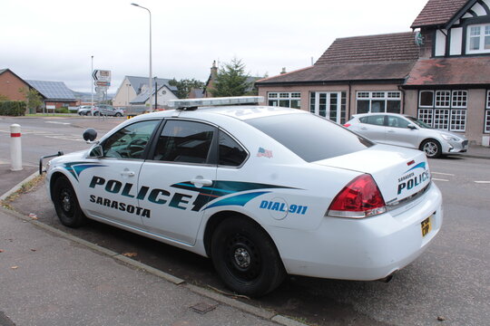 Side view of a Chevrolet painted to look like a Sarasota police car, Edzell, Scotland, 11-10-2022