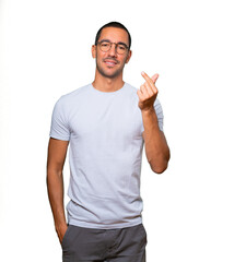 Fototapeta premium Young man making a gesture of worried about his economy