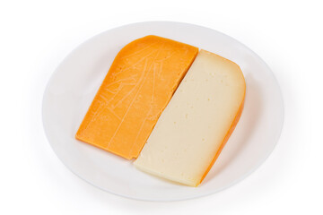 Two different semi-hard cheese on dish on white background