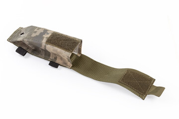 Open military textile pouch for tourniquet on a white background